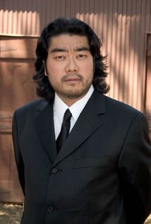 Kurando Mitsutake. Director of Gun Woman